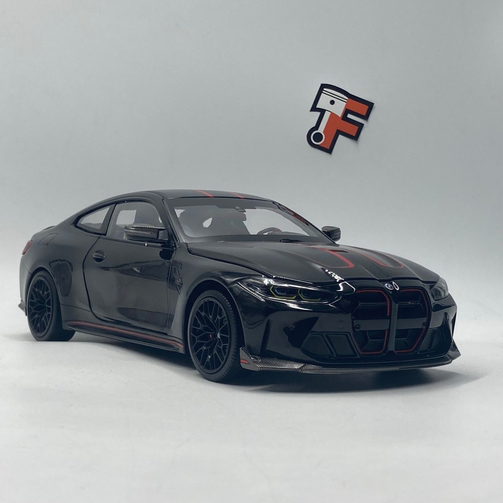 Miniature BMW M4 CSL 2023 noire Noir Saphir Minichamps 1/18 en Suisse