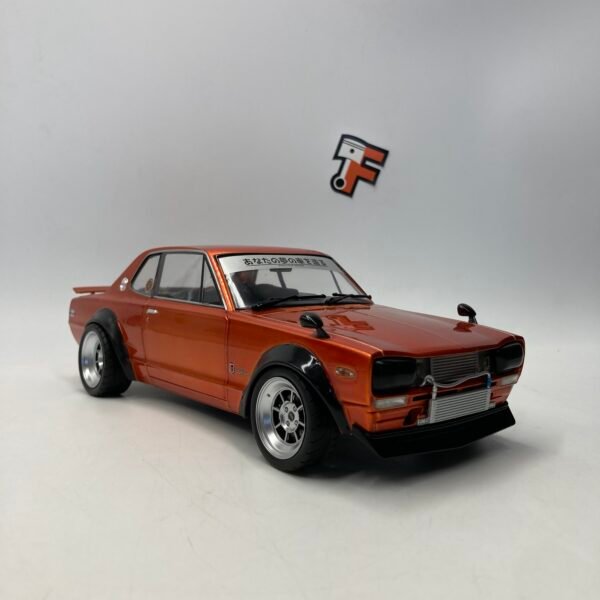 Miniature Nissan Skyline C10 Hakosuka Orange échelle 1/18 vendue en Suisse