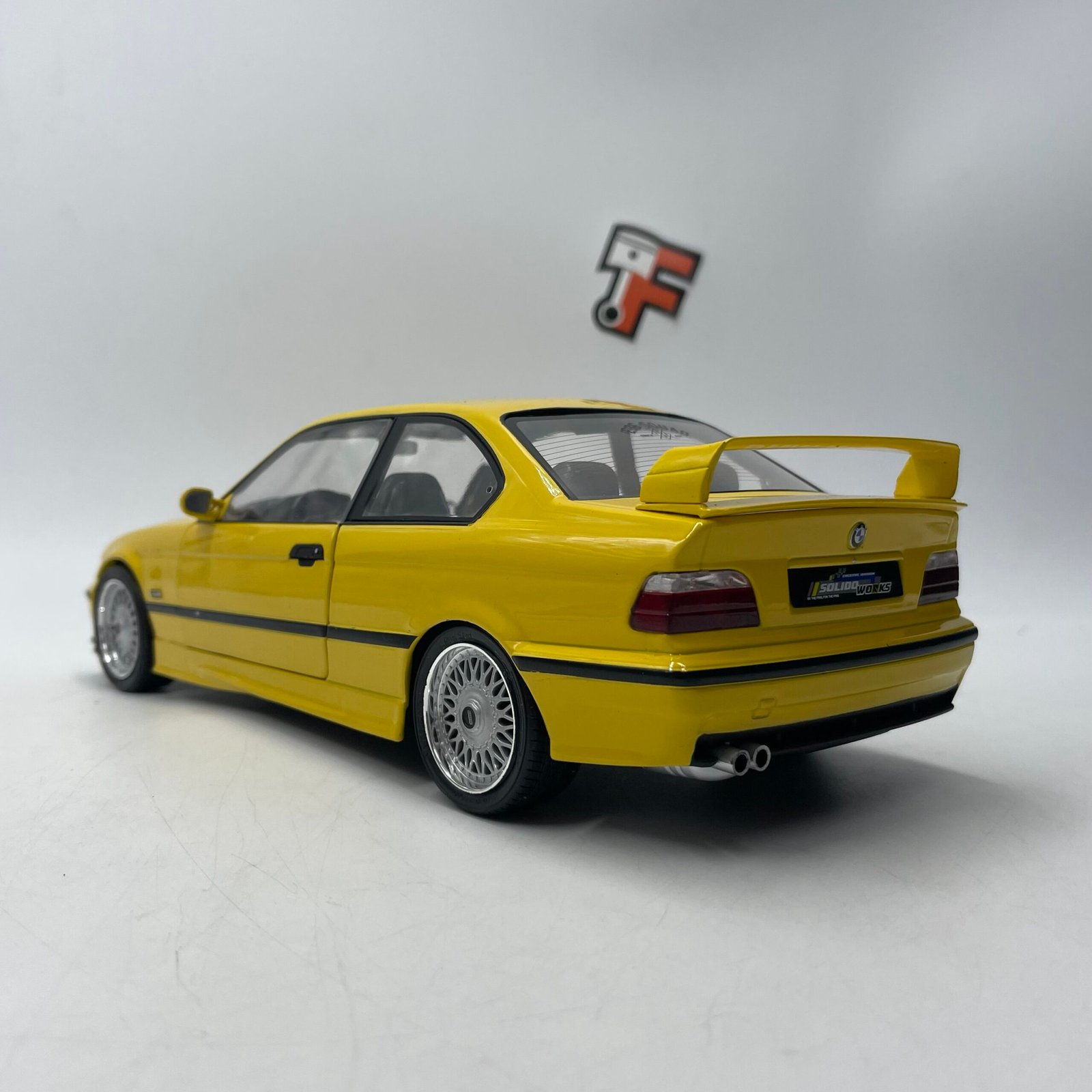 Miniature BMW M3 E36 Coupé Dakar Yellow 1991 1/18 vendue en Suisse