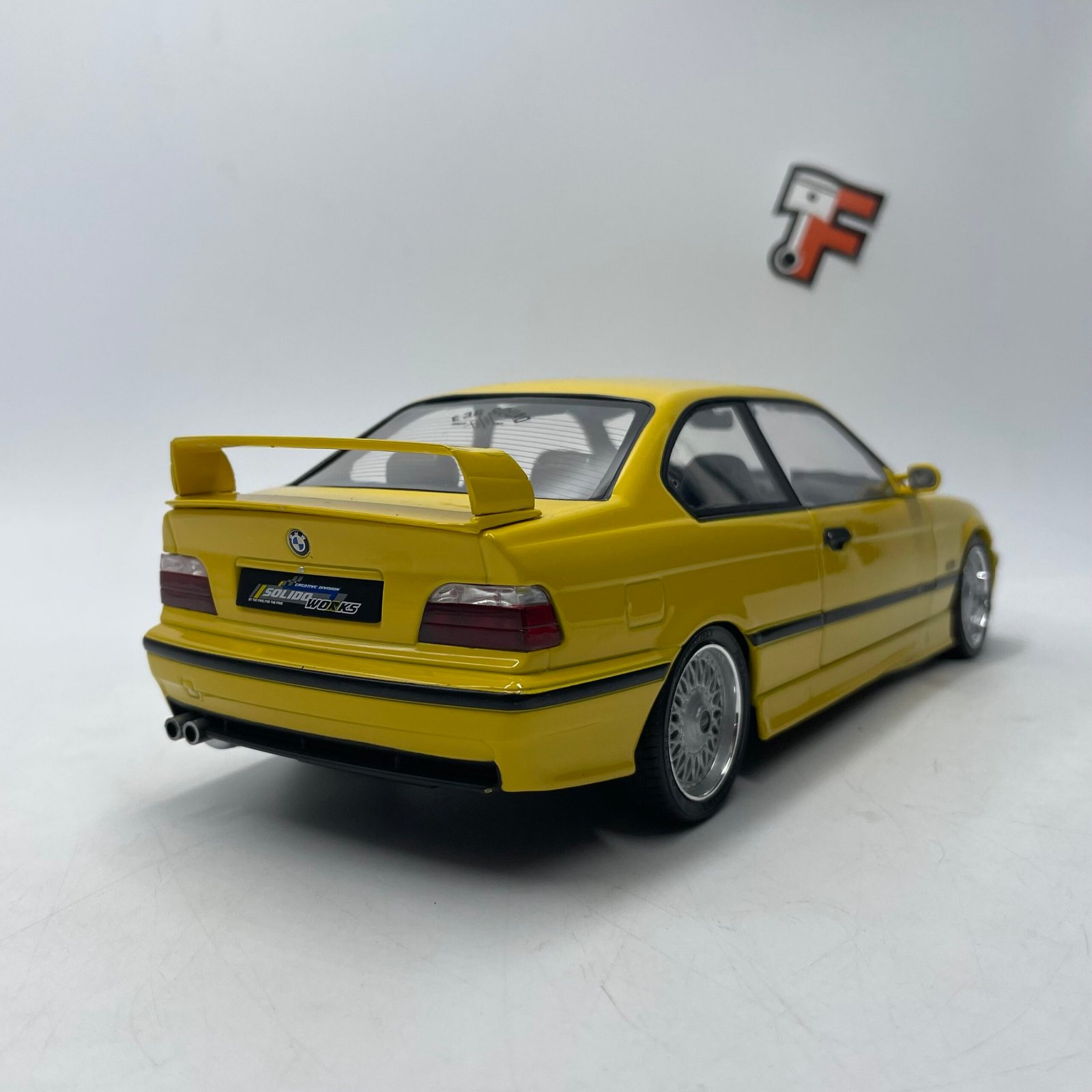 Miniature BMW M3 E36 Coupé Dakar Yellow 1991 1/18 vendue en Suisse