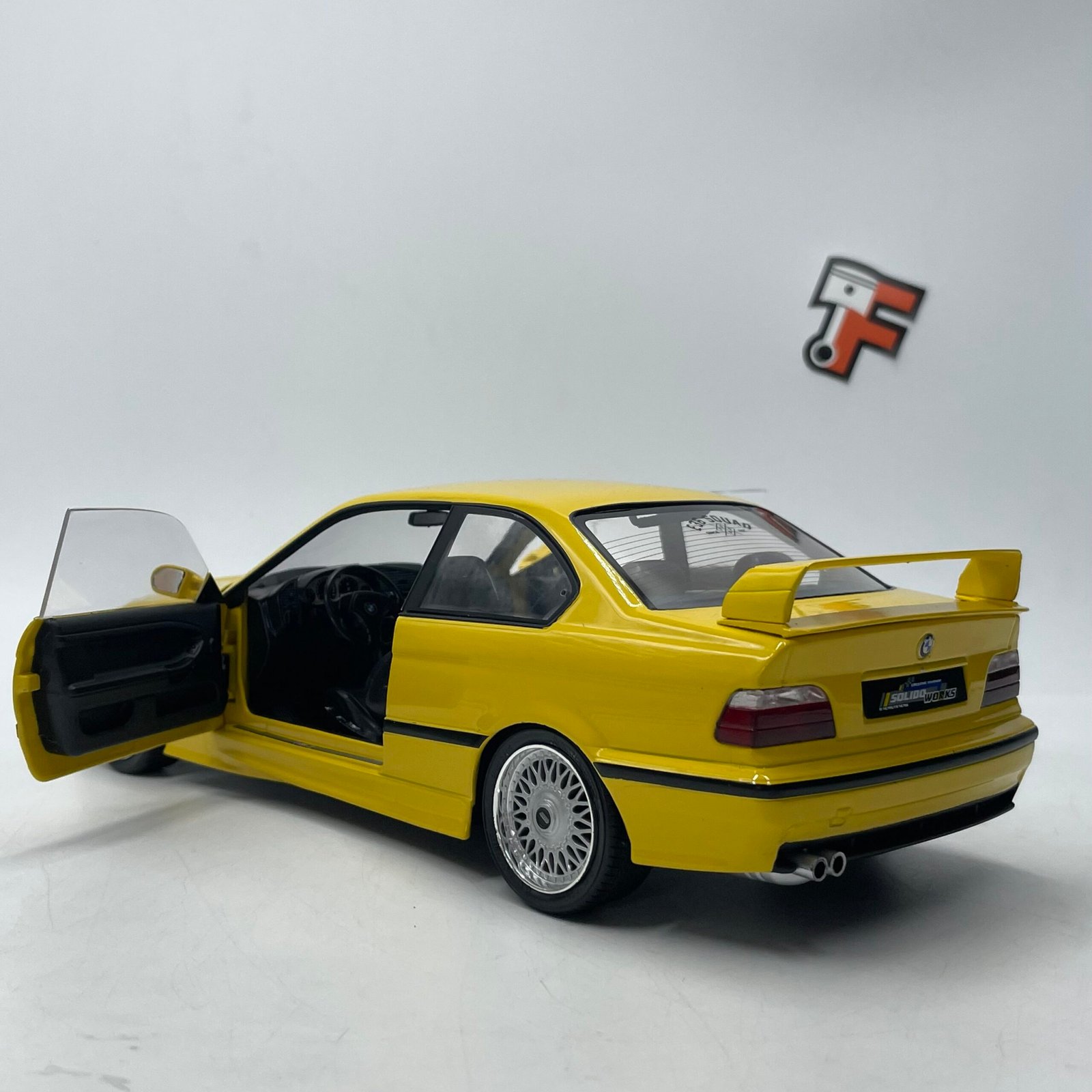 Miniature BMW M3 E36 Coupé Dakar Yellow 1991 1/18 vendue en Suisse